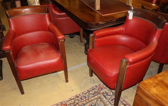 A set of six mahogany framed tub shaped theatre viewing armchairs, with red leather upholstery (by repute from Croydon Theatre)